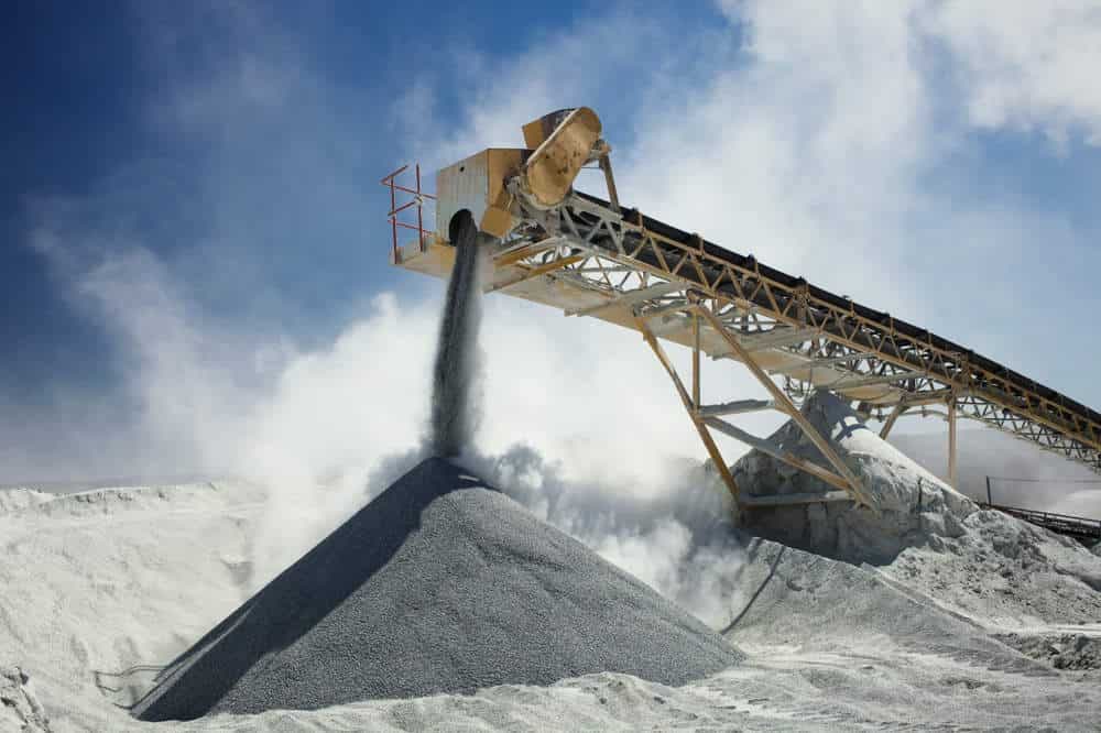 Powerful sand crushing machinery in action.
